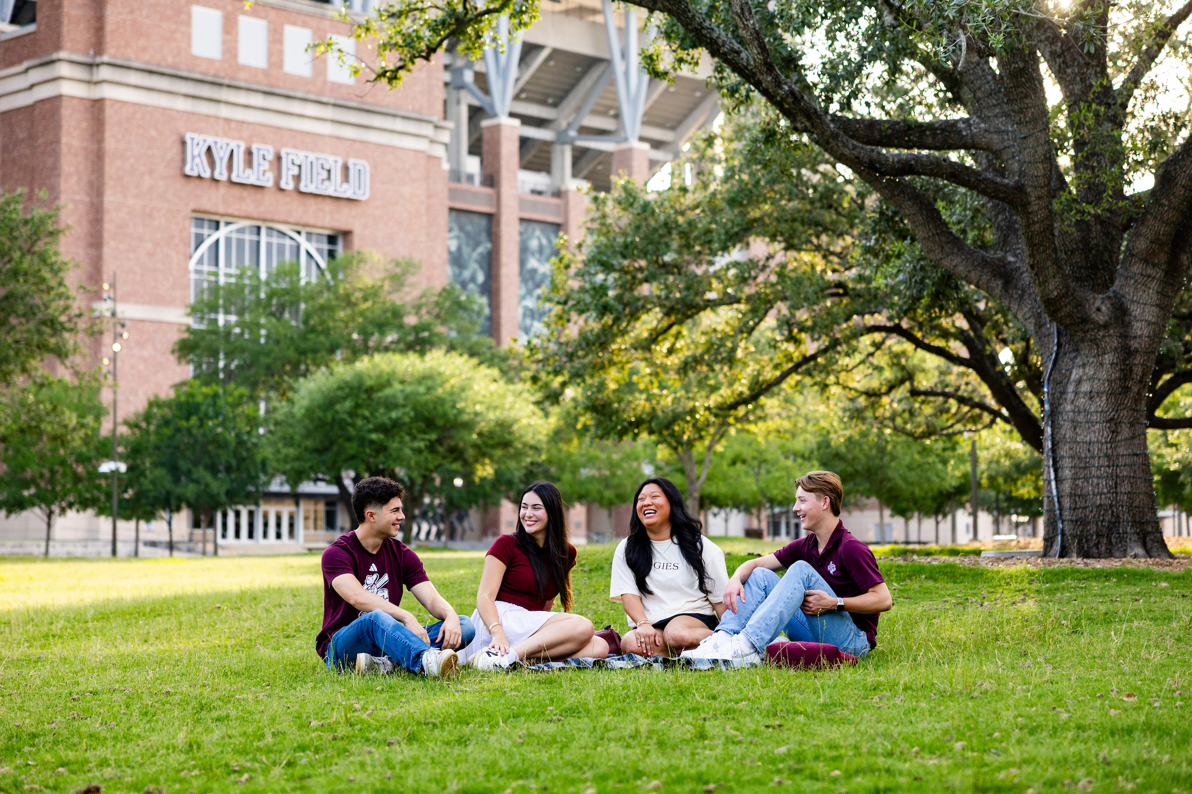 Students sitting together in Aggie Park
