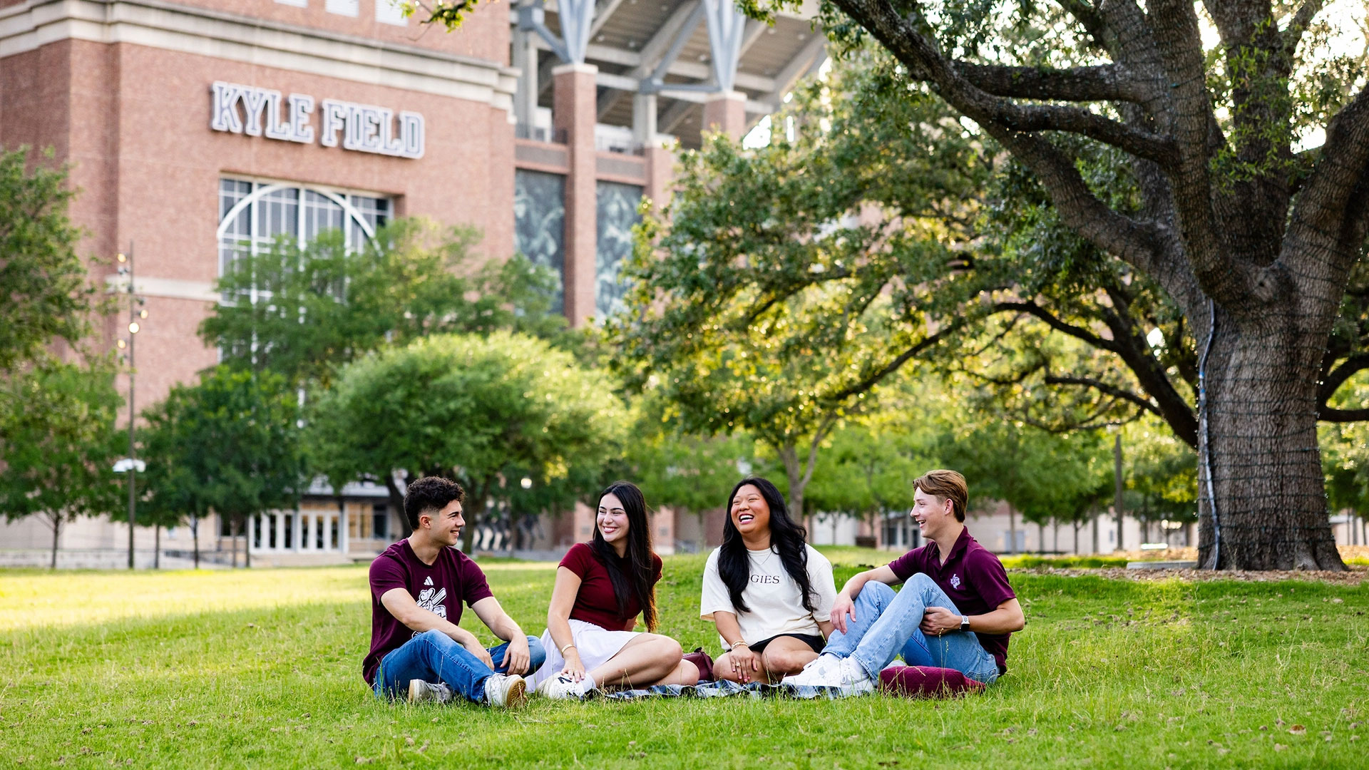 Students sitting in Aggie Park