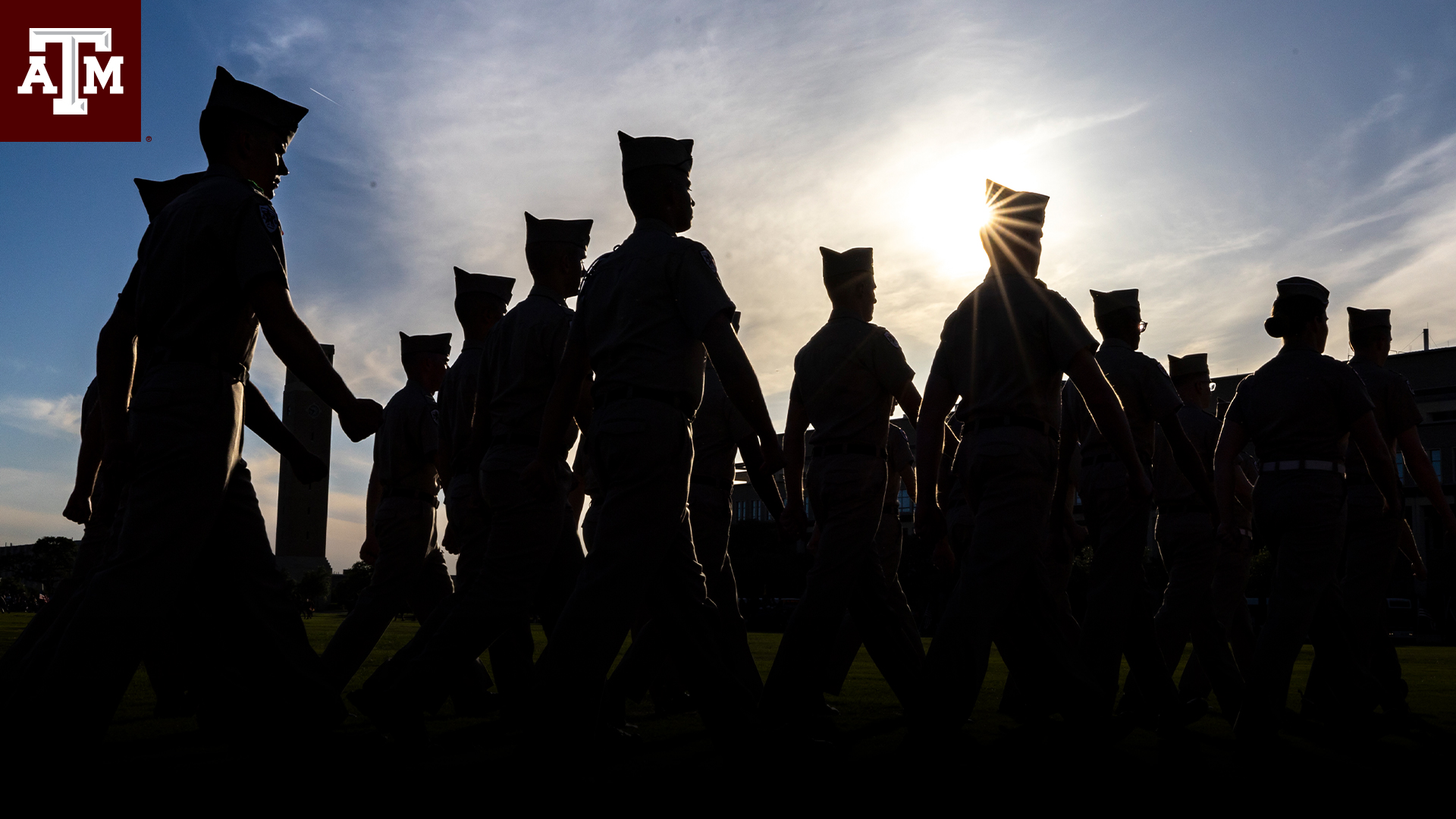 Corps of Cadets members walking in shadow